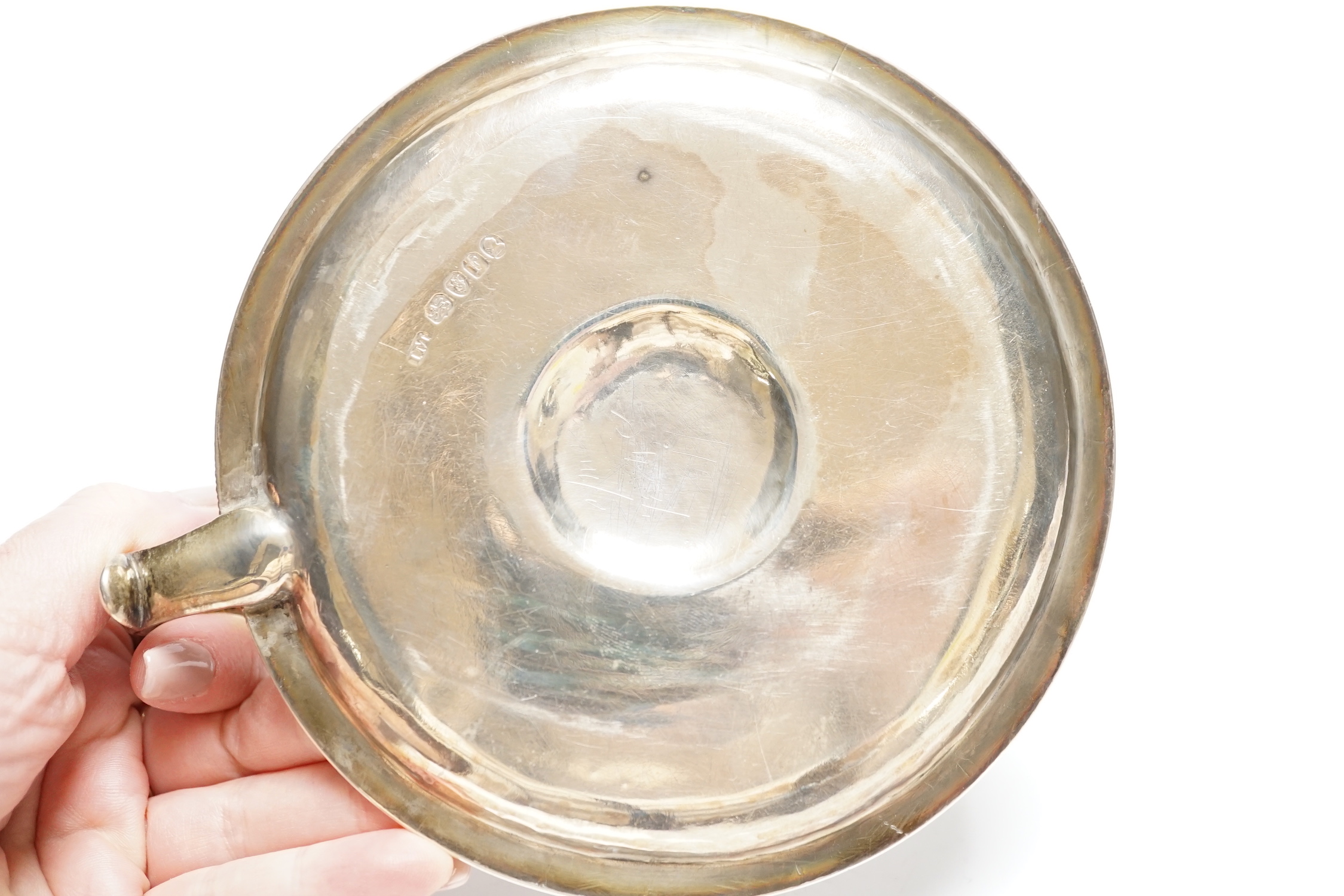 A George III silver chamberstick, John Mewburn, London, 1801, with extinguisher(marks rubbed), diameter 13.7cm, 9.7oz.